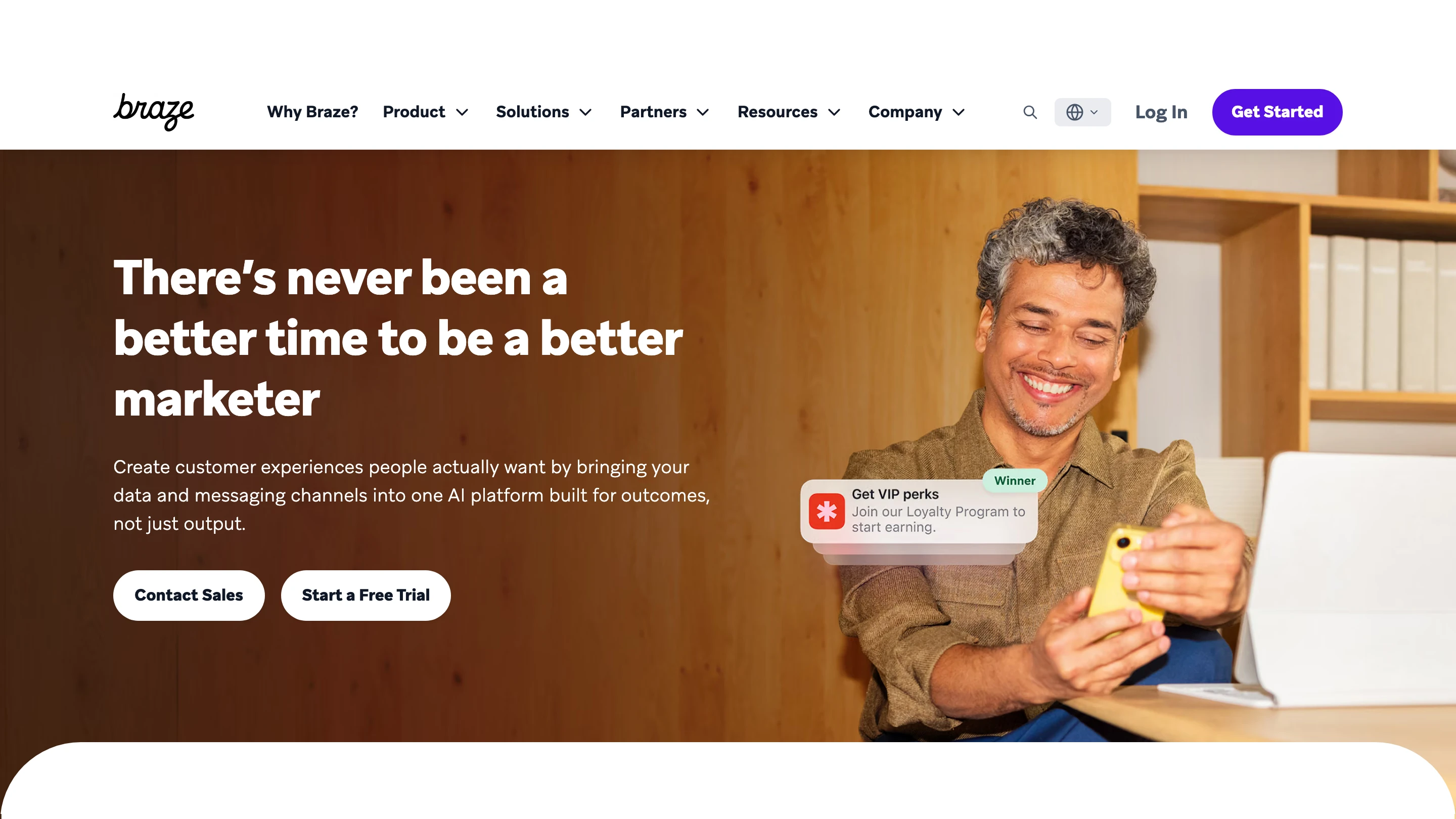 Braze's homepage: a customer engagement platform for marketers, with a loyalty push notification on a phone